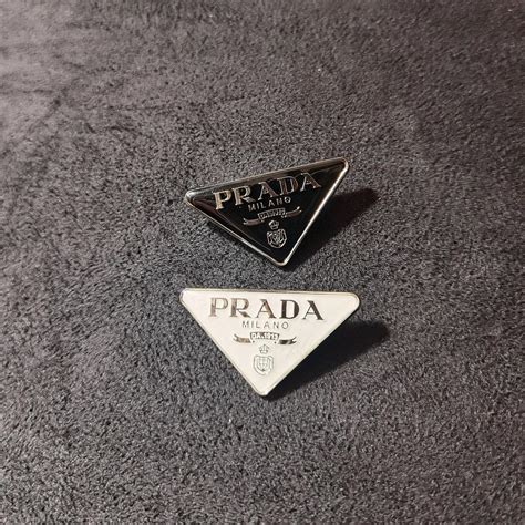 prada brooch.